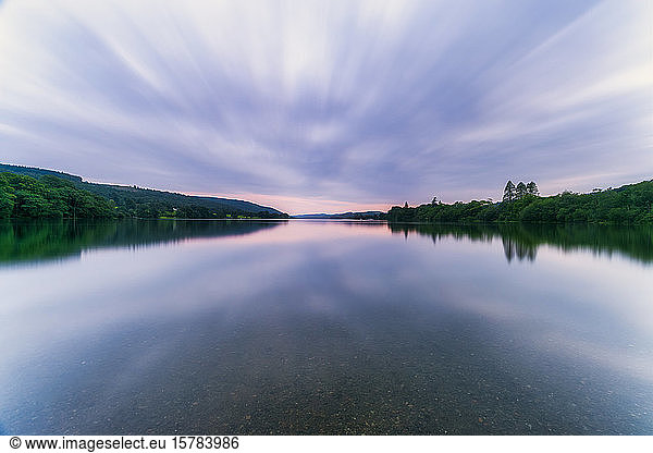 UK  England  Long exposure of clouds over Coniston Water lake at dusk