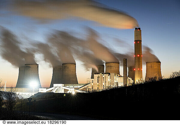 UK  England  Nottingham  Long exposure of water vapor rising from cooling towers of coal-fired power station at dusk