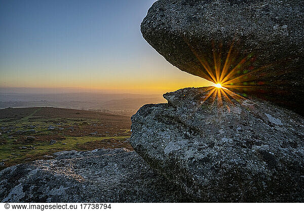 UK  England  Sun setting behind tors in Dartmoor