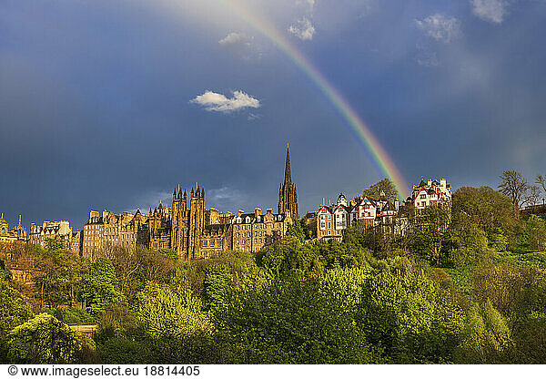 UK  Scotland  Edinburgh  Rainbow arching over old town skyline