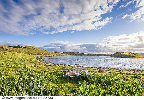 UK  Scotland  Eswick  Rowboat left on grassy shore
