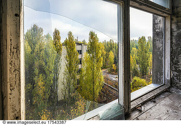 Ukraine  Kyiv Oblast  Pripyat  Abandoned city seen through broken window