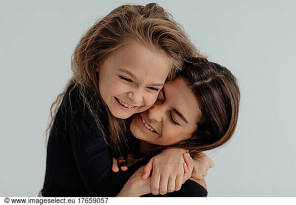 Ukrainian happy sisters hug each other. Concept of love and peace