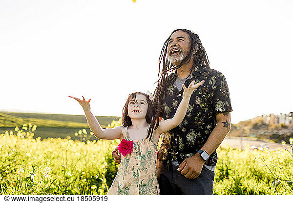 Uncle & Niece Standing in Flower Field in San Diego