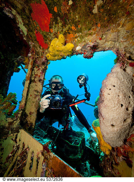 Underwater photographer on wreck