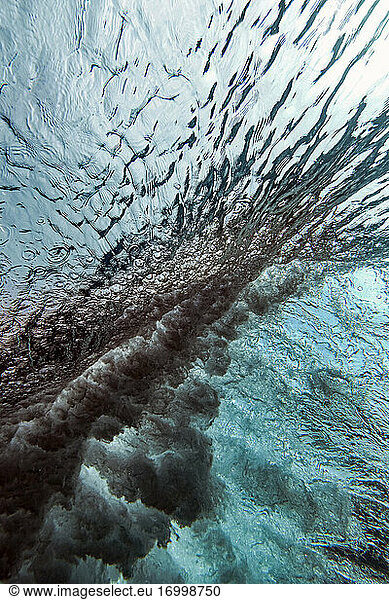Underwater view of splashing wave