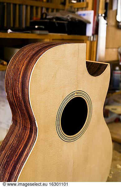Unfinished guitar in a workshop