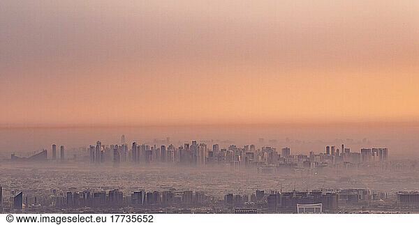 United Arab Emirates  Dubai  Panoramic view of city downtown at foggy dawn