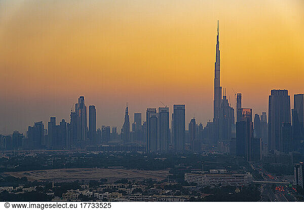 United Arab Emirates  Dubai  Tall skyline skyscrapers at moody dusk