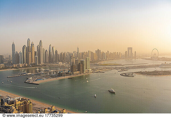 United Arab Emirates  Dubai  View of coastal city at sunset