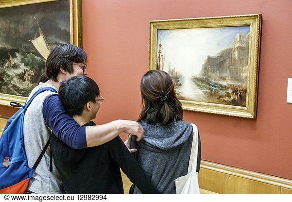 United Kingdom Great Britain England  London  Westminster  Millbank  Tate Britain art museum  inside interior  gallery  painting  Regulus by JMW Turner  Asian  man  father  boy  teen  family  looking