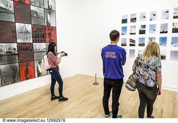 United Kingdom Great Britain England  London  Westminster  Millbank  Tate Britain art museum  inside interior  gallery  photography  Gilbert & George  Red Morning Trouble  1977  Wolfgang Tillmans  Concorde Grid  1997  man  woman  girl  teen  student  taking photo  camera