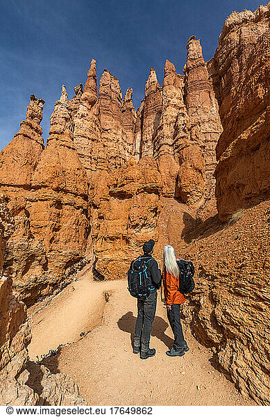United States,  Utah,  Bryce Canyon National Park,  Senior hiker couple exploring Bryce Canyon National Park