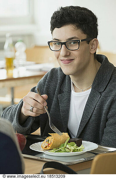 University student eating lunch in canteen School  Bavaria  Germany