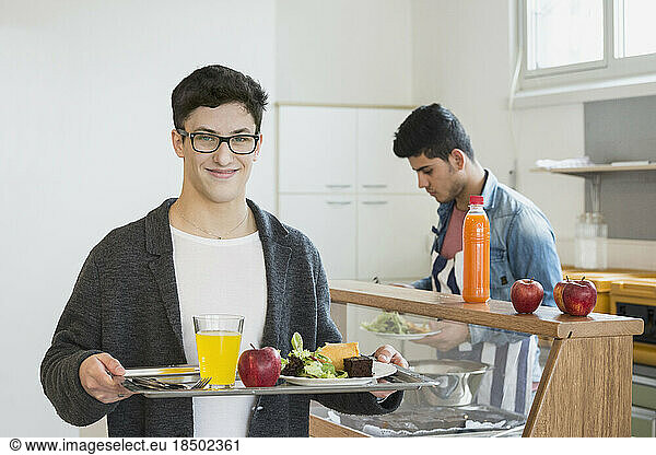 University student with his lunch in plate School  Bavaria  Germany