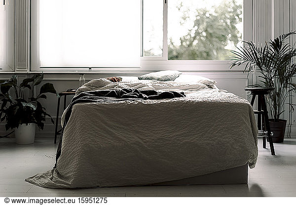 Unmade bed in a loft