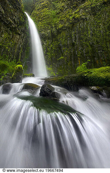 Up-close perspective of cascade and waterfall in Oregon's Columbia Gorge.