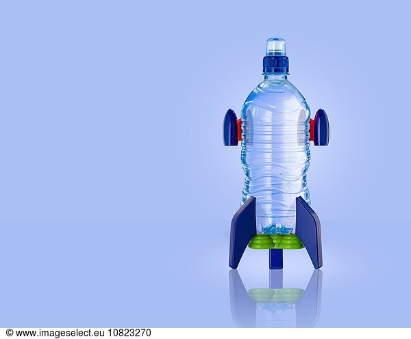 Upright water bottle rocket with blue background