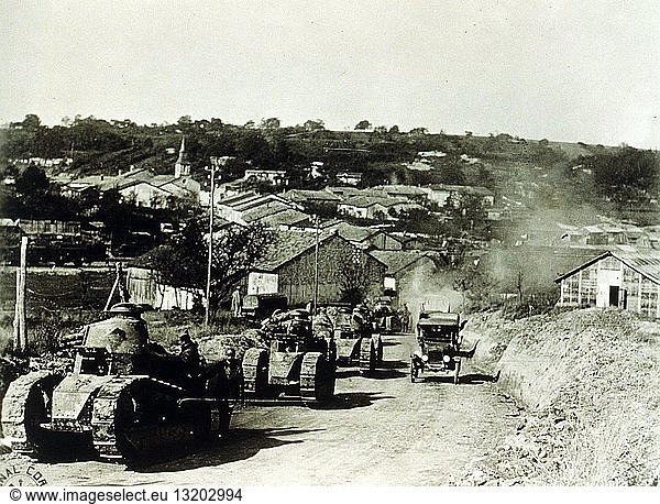 US Army  337th Co  13 Bat 505th Reg--French tanks passing thru Rampont  France during World War I  dated 1918. Summary: Convoy of tanks leaving Rampont in the French countryside.