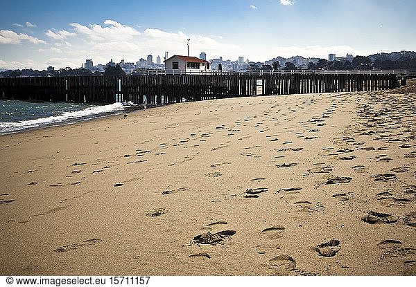 USA  California  San Francisco  Footprints on sandy coastal beach