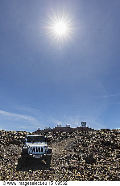 USA  Hawaii  Mauna Kea volcano  Mauna Kea Observatories  off road vehicle on a gravel road