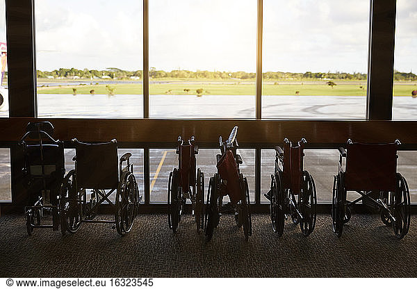 USA  Hawaii  row of parked wheelchairs at the airport