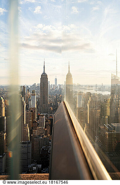 USA  New York  New York City  Midtown Manhattan at sunset seen through window