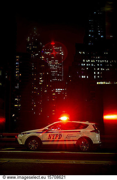 USA  New York  New York City  NYPD night patrol car with emergency lights turned on