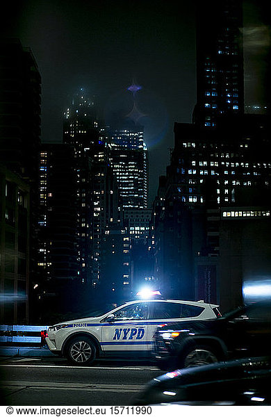 USA  New York  New York City  NYPD night patrol car with emergency lights turned on