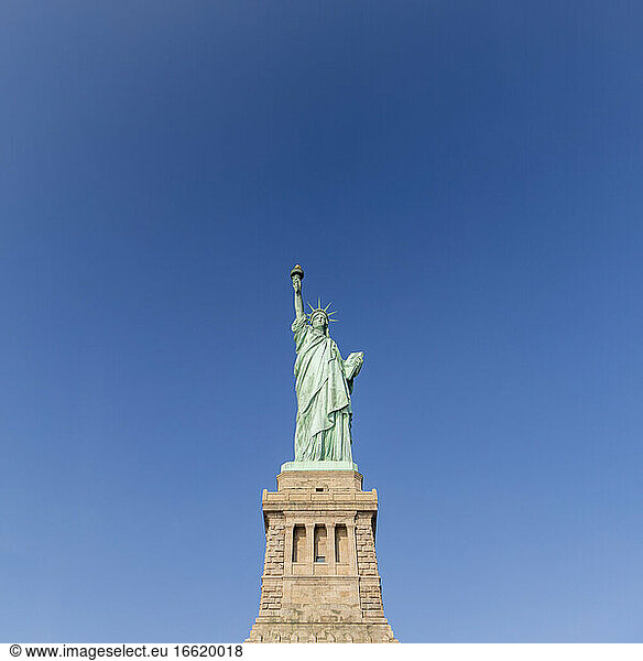 USA  New York  New York City  Statue of Liberty against blue sky