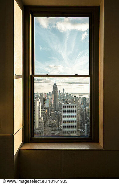 USA  New York  New York City  Window overlooking Midtown Manhattan at sunset