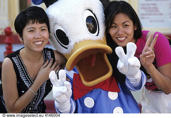USA  United States of America  California: Disneyland  tourists with Donald Duck.