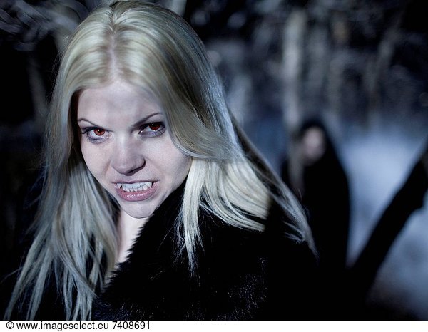 USA  Utah  Cedar Hills  Portrait of female vampires outdoors at night