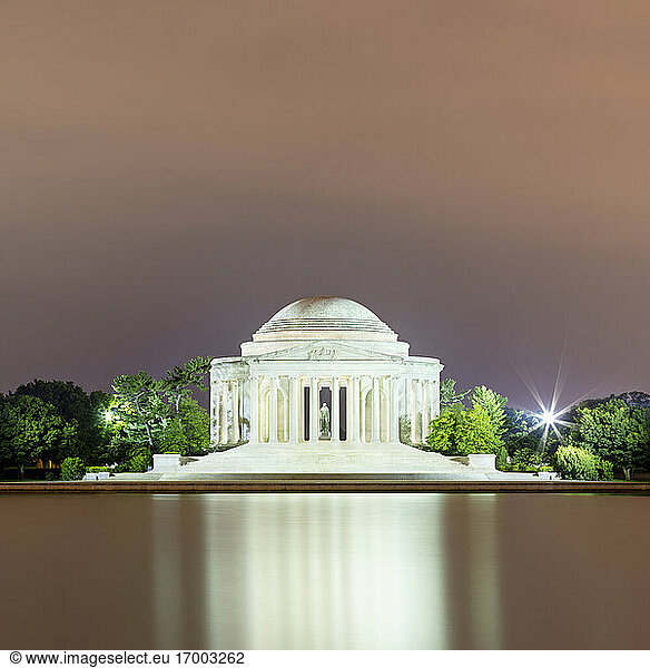USA  Washington DC  Jefferson Memorial reflecting in Tidal Basin at dusk