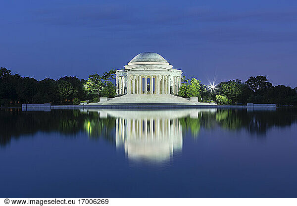 USA  Washington DC  Jefferson Memorial reflecting in Tidal Basin at dusk