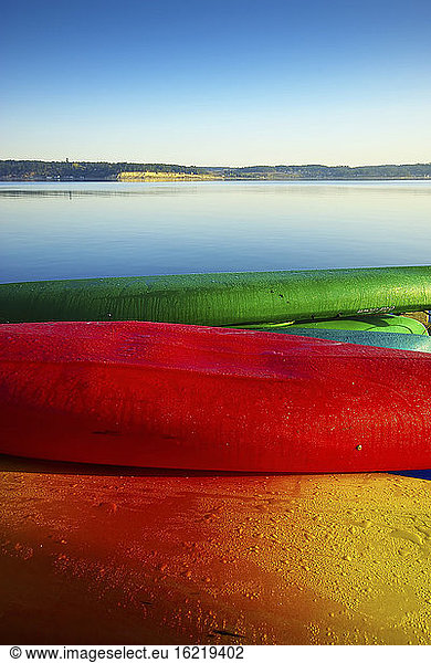 USA  Washington  View of colourful canoes at sea