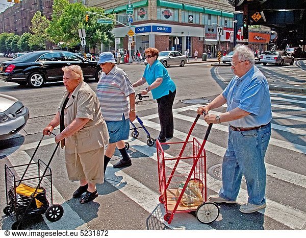 Using walkers  elderly locals cross Coney Island Avenue in the ´Little Odessa´ neighborhood of Brighton Beach in Brooklyn  New York The area is largely populated by Russian immigrants