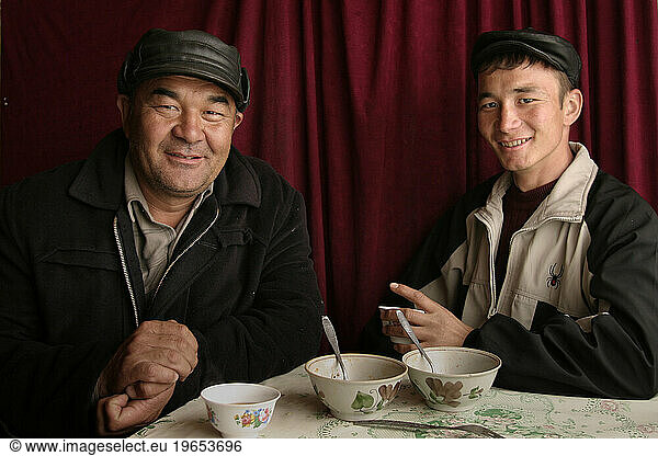 Uzbek father and son at lunch