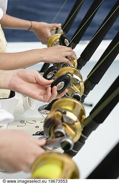 Vacationer's are poised for action as the hold their deep sea fishing rods.