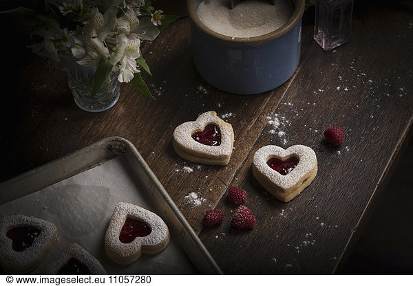 Valentine's Day baking  high angle view of a baking tray with heart shaped biscuits.