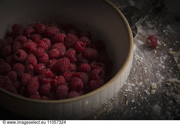 Valentine's Day baking. High angle view of a bowl of fresh raspberries.