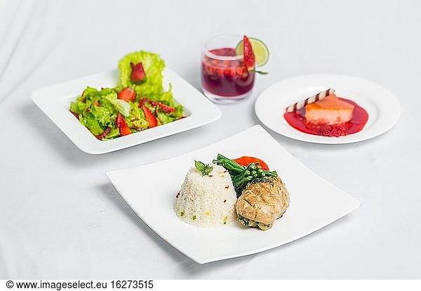 Valentine's day special dinner course food platter on isolated white background. Valentine's meal platter. Valentine's day food offer.