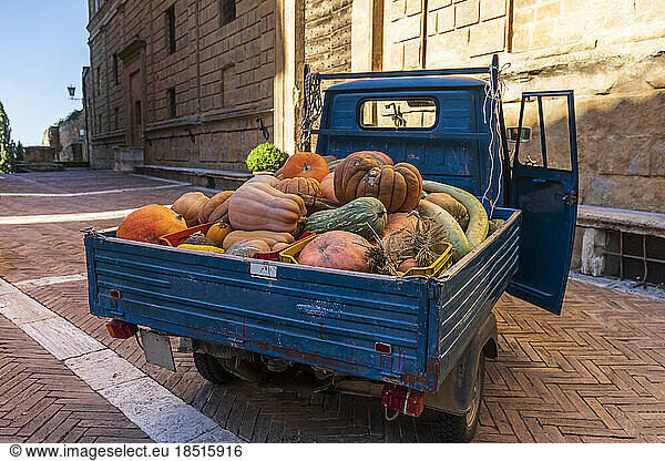 Van transporting heap of pumpkins