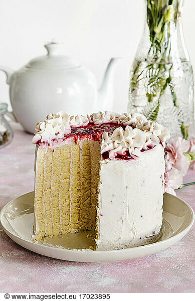 Vanilla and raspberry sponge roll cake