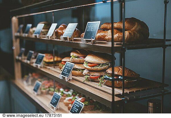 Varieties of bread specialties arranged on display in cafe