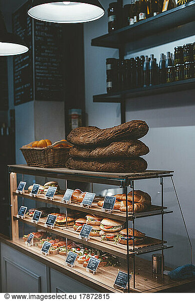 Varieties of breads arranged on display in cafe