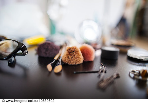 Various beauty products on table in studio