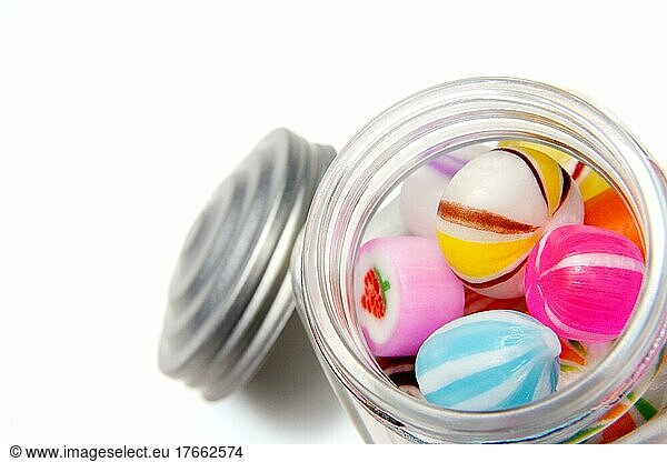 Various candies inside a glass jar