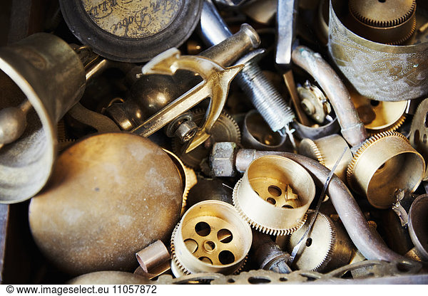 Various clock parts within a clock maker's workshop.
