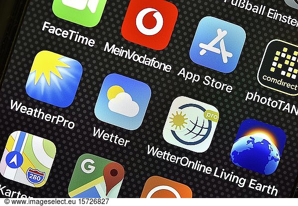 Various weather apps on display of an Apple iPhone  Germany  Europe